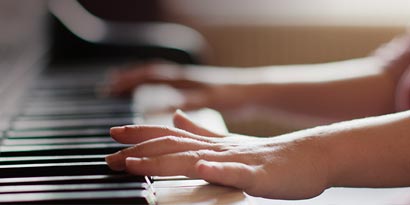 Child playing piano 
