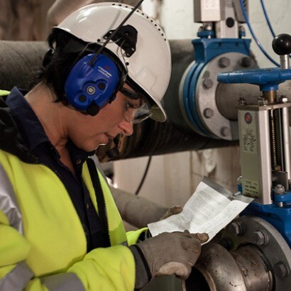 Safety specialist wearing Safety helmet with Peltor Communication Headset