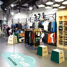 Hall with clothes and storage units. On the floor you see 3M Floor Graphics.