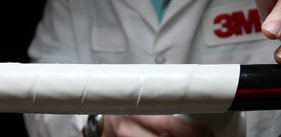 White 3M tape protects electrical cables from electrical arcs.
