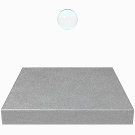 Learn how wet out helps determine adhesive choice for low- and high-surface energy substrates. Image of a droplet of water landing on a surface. The water spreads own to illustrate a high surface energy substrate surface. 