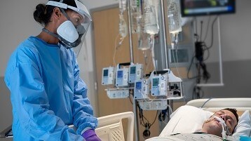 Staff with resipratory protection in ICU
