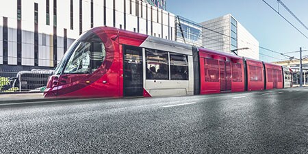  A train installed with 3M Coloured Film - pulling into a station
