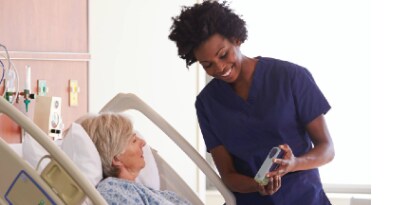 Nurse at hospital showing Prevena product to a patient
