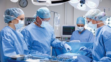 doctors apply incise drape to patient