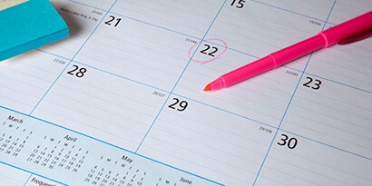 image of Post-it® notes on top of a desk calendar
