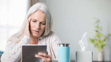 Image of patient at computer/with ipad
